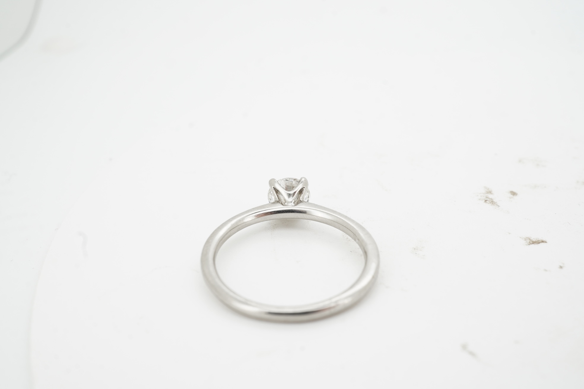 A diamond ring, claw-set with a brilliant-cut diamond weighing approximately 0.52 carats, mounted in platinum, size L1/2, British hallmarks, gross weight approximately 3 grams